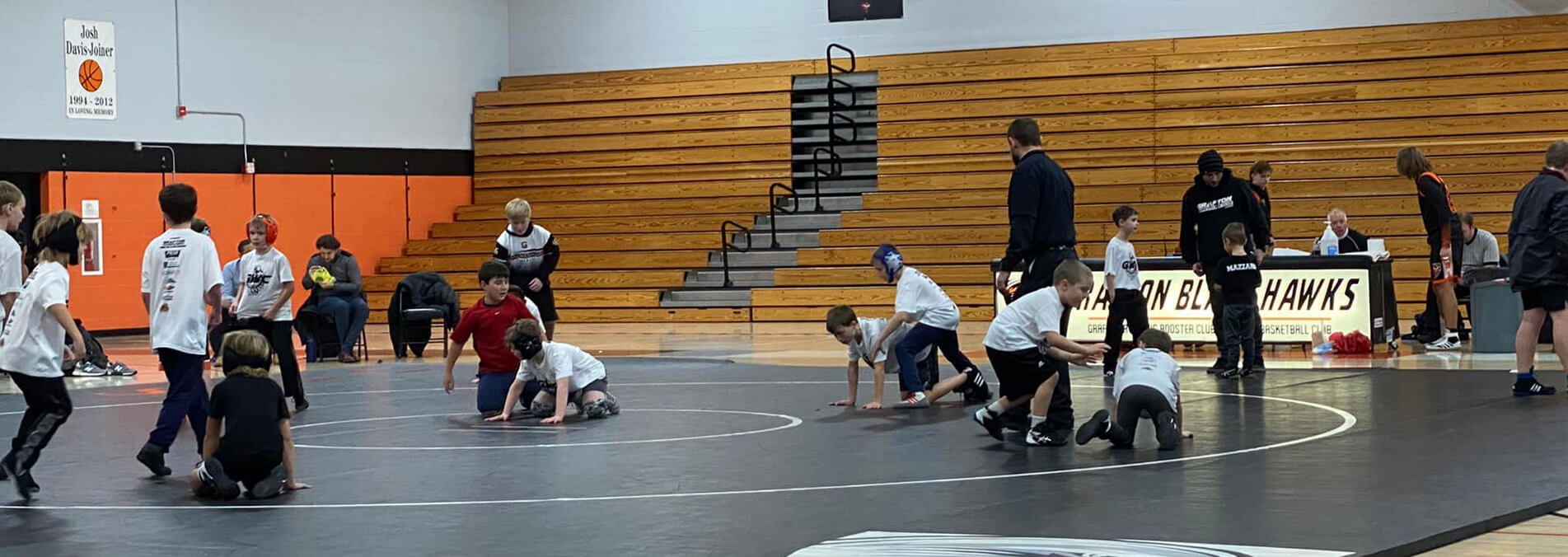 Kids Wrestling On Mat